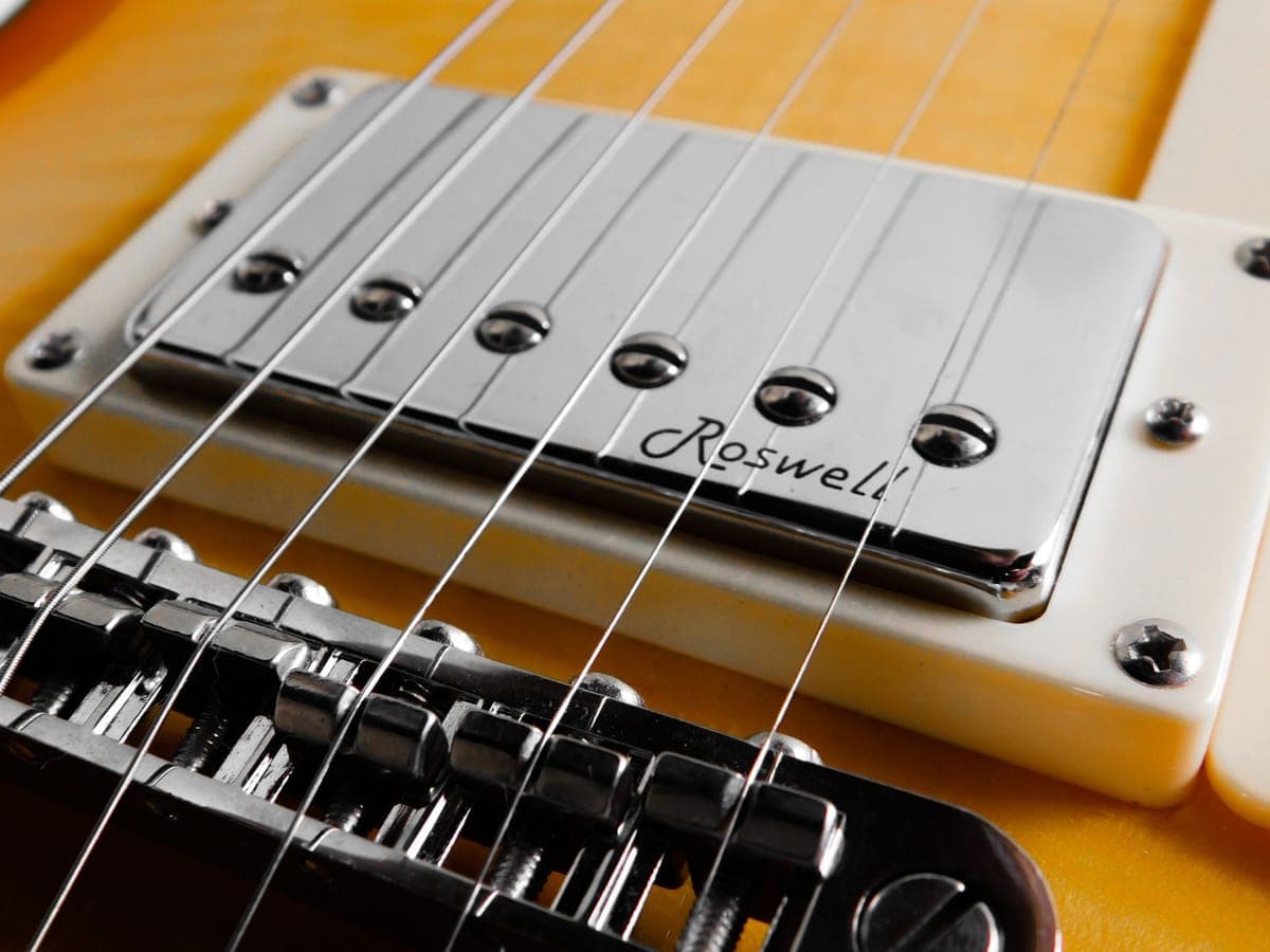 Electric guitar strings across the pickups — a stand-in for the D'Addario XL Nickel Wound Super Light, 9–42 (EXL120), not a photograph of this model