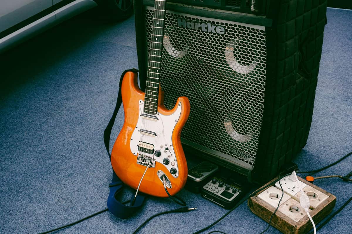 An electric guitar in a padded gig bag