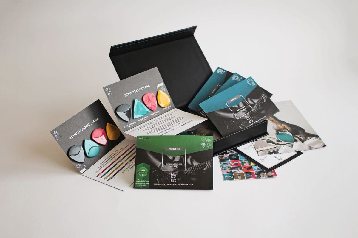 A tuner, picks and a care cloth arranged as a gift set
