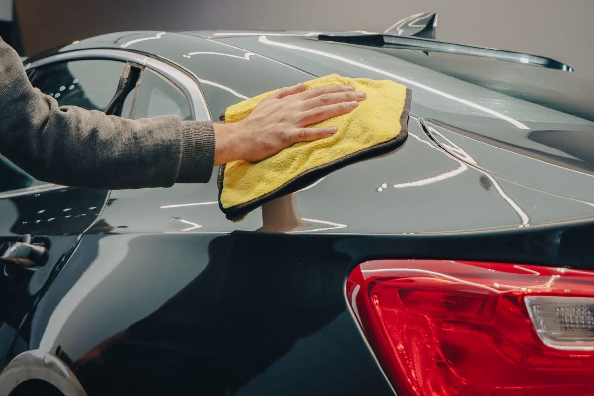 A cloth polishing a glossy surface