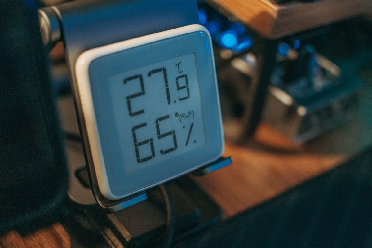 A digital hygrometer displaying relative humidity and temperature