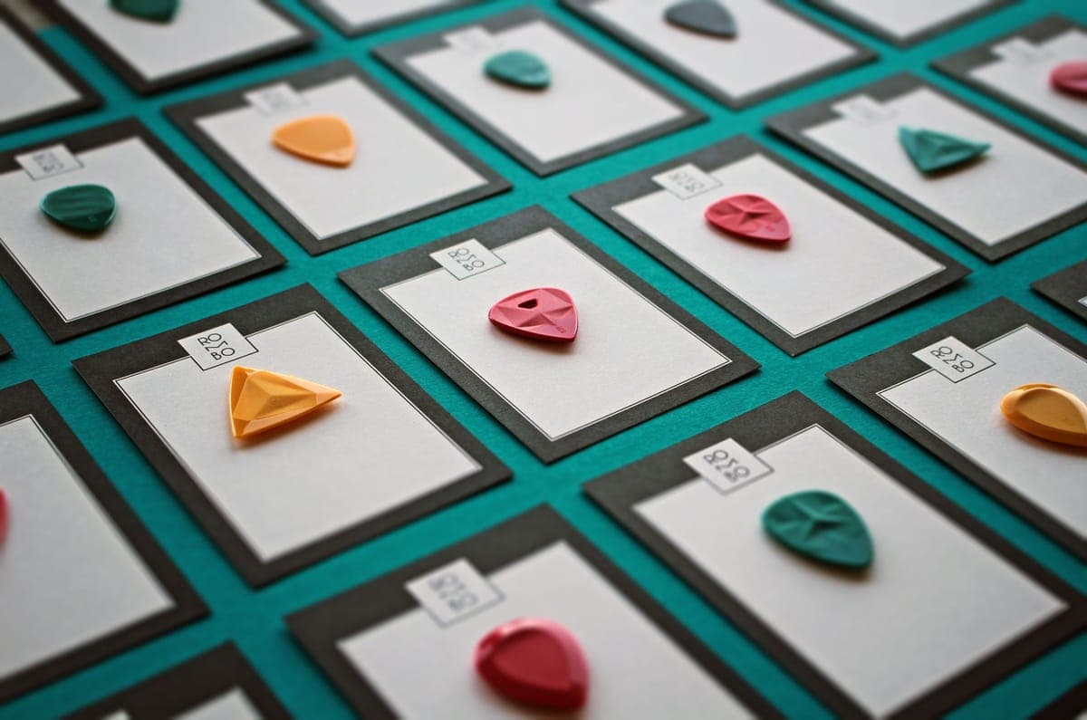 Guitar picks of several thicknesses fanned out