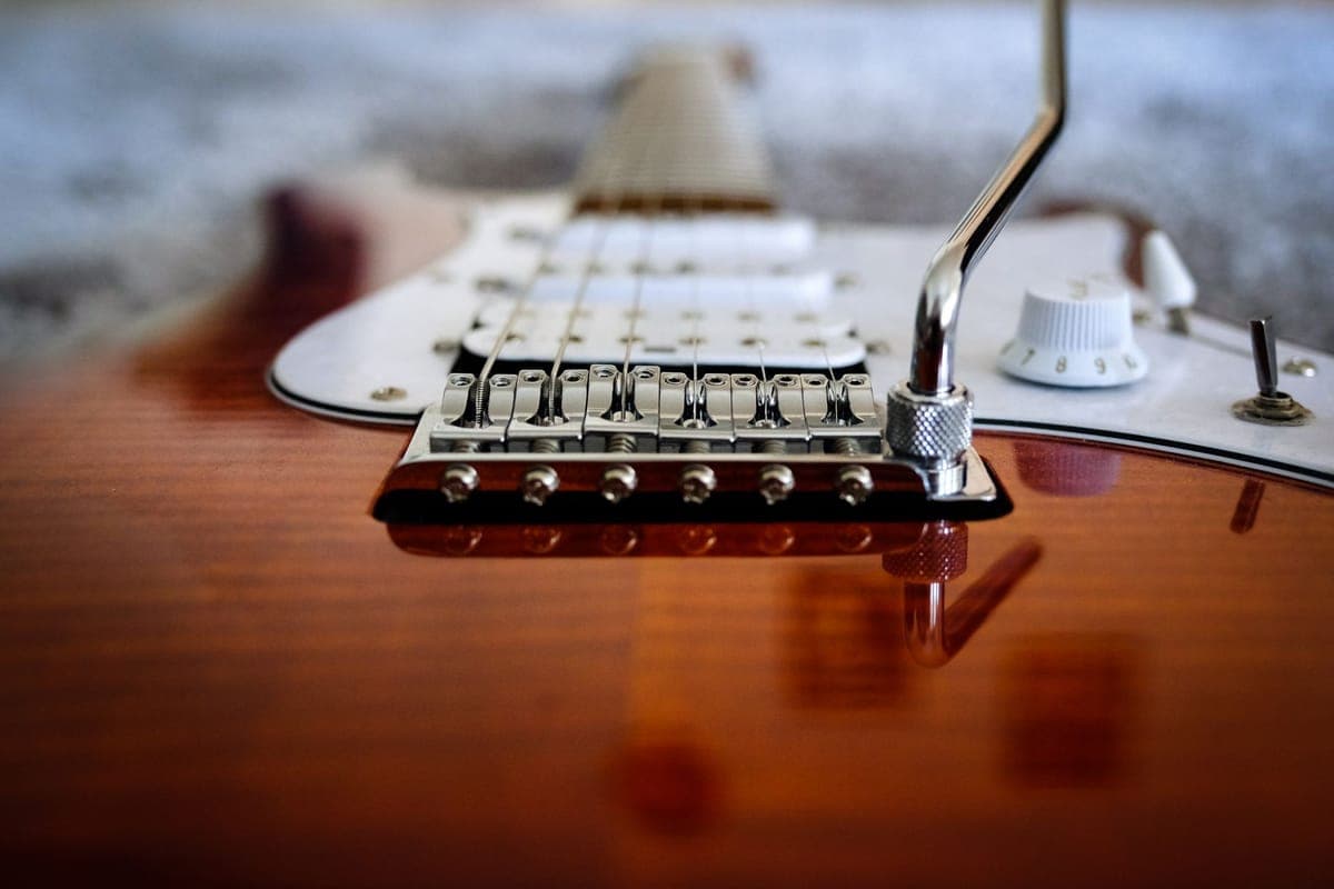 Electric guitar strings across the pickups of a solid-body guitar
