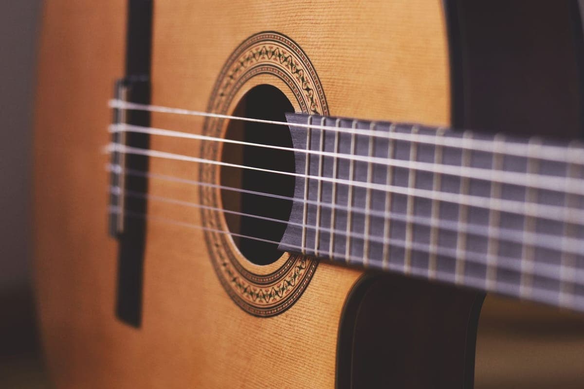 The nylon strings and tie block of a classical guitar bridge